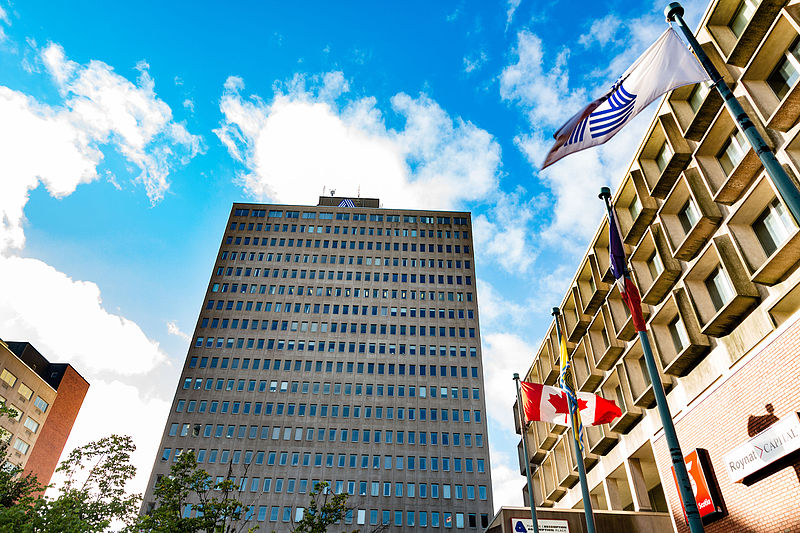 A photo of a big office building, taken from a low angle so it looks tall and impressive.