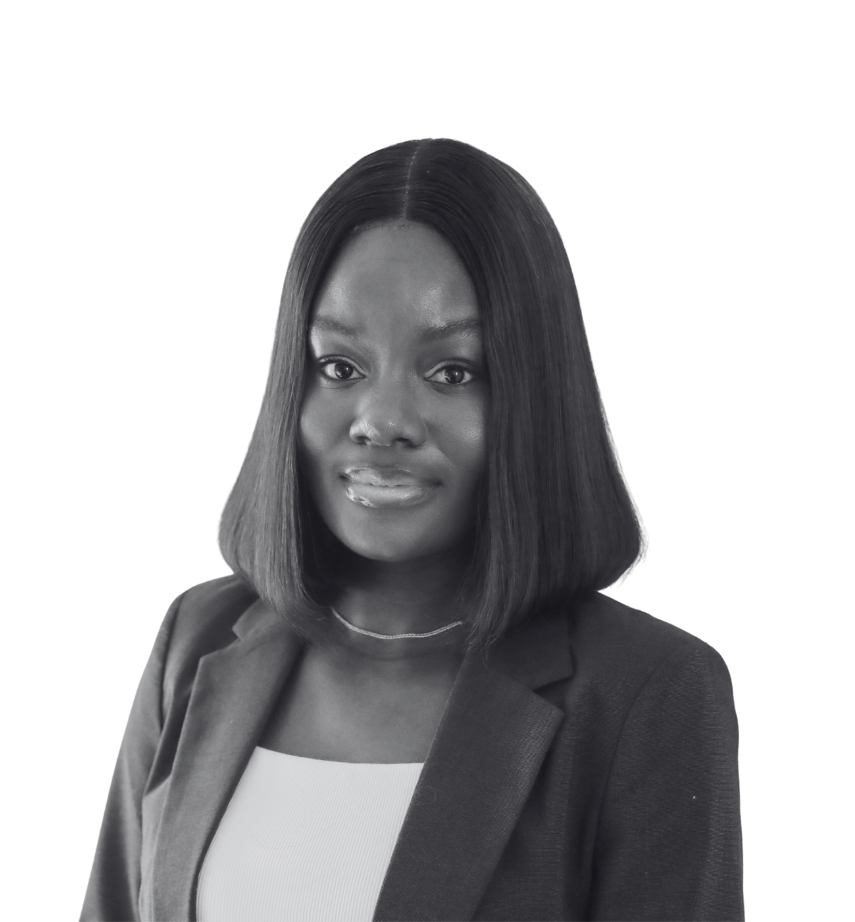 Headshot of Stephanie Amole against a plain white background. Stephanie is smiling and wearing a dark blazer over a white top.