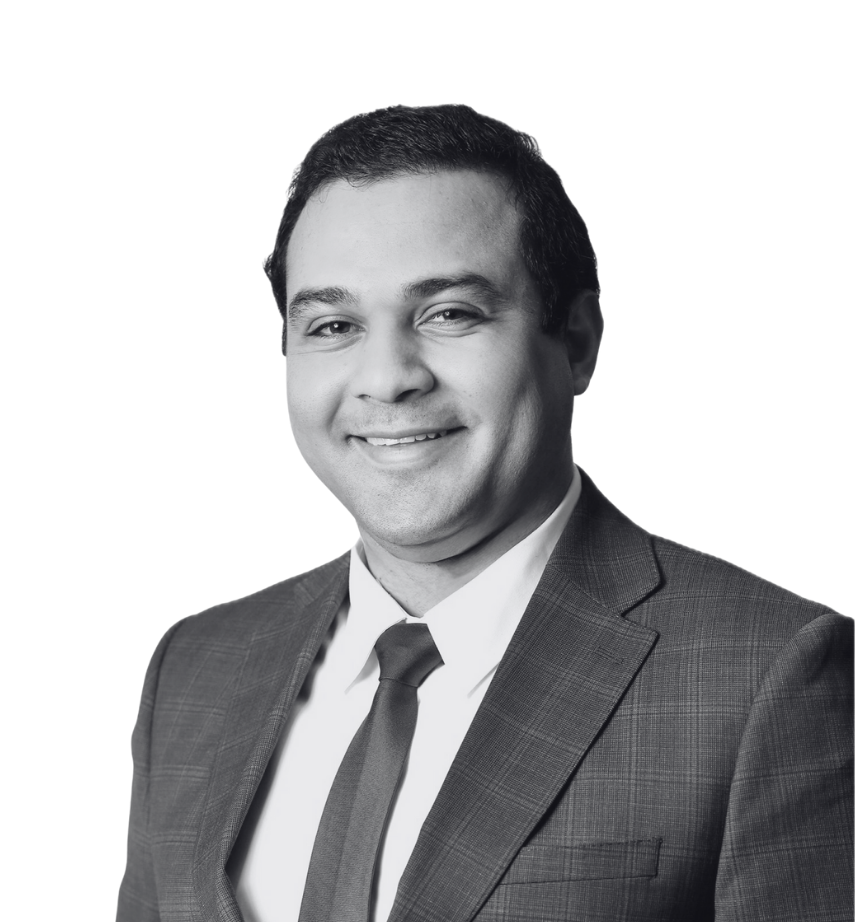 Headshot of Mahdi Ellorhaoui against a plain white background. Mahdi is smiling and wearing a suit and tie over a white dress shirt.